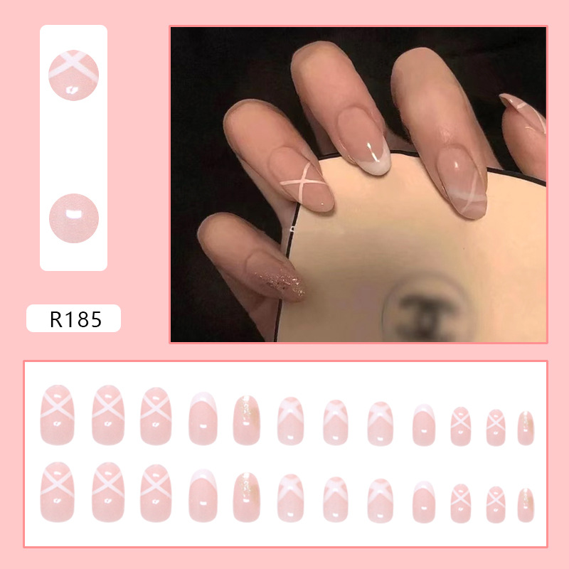 Pink white French swirl nails with glitter press on nail accents