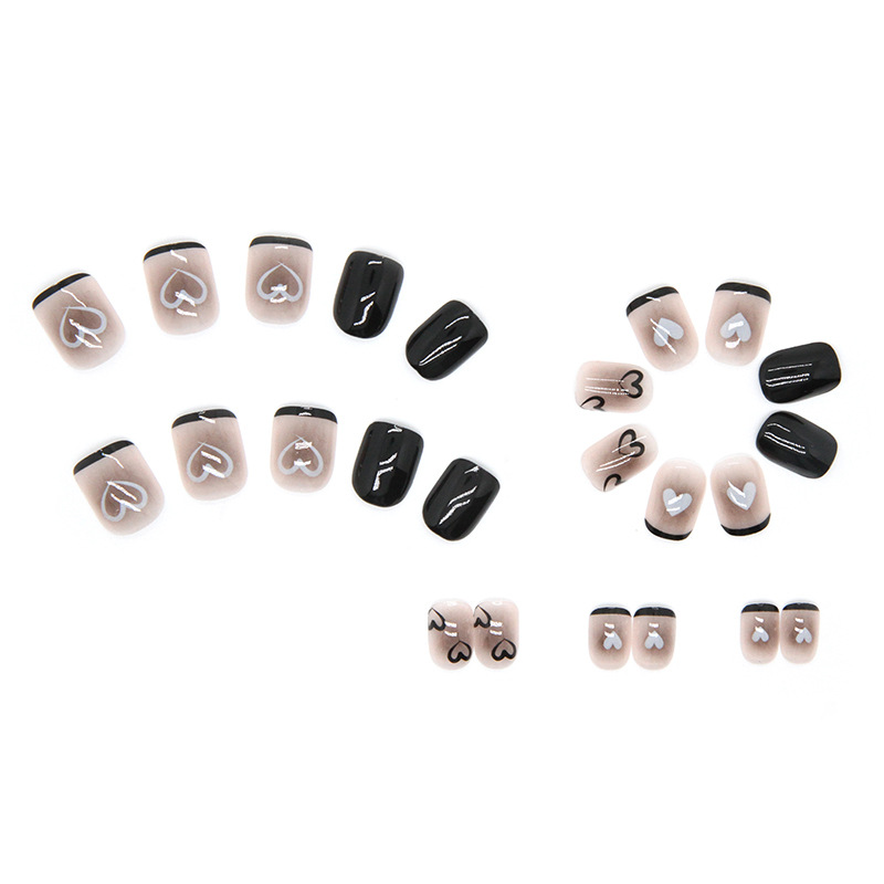 Black heart nail art press on nails with nude pink base