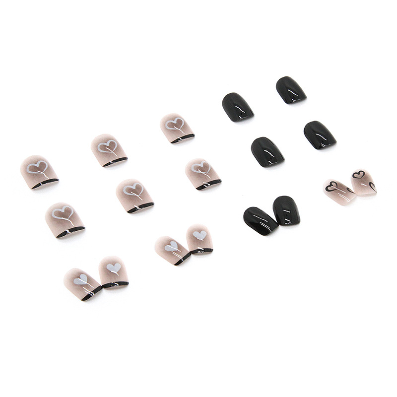Black heart nail art press on nails with nude pink base