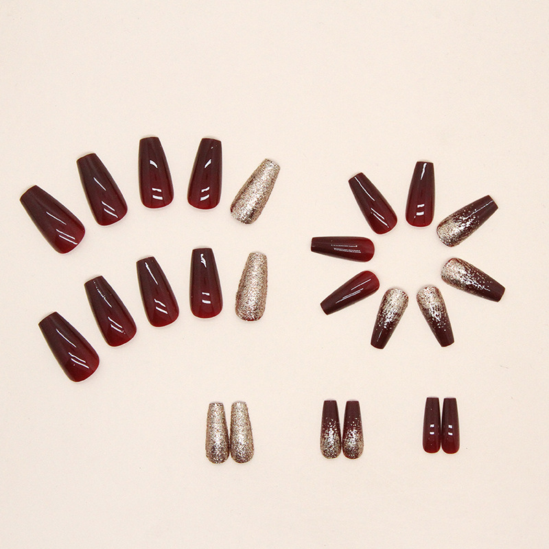 Burgundy glitter nails with gold sparkle press on design