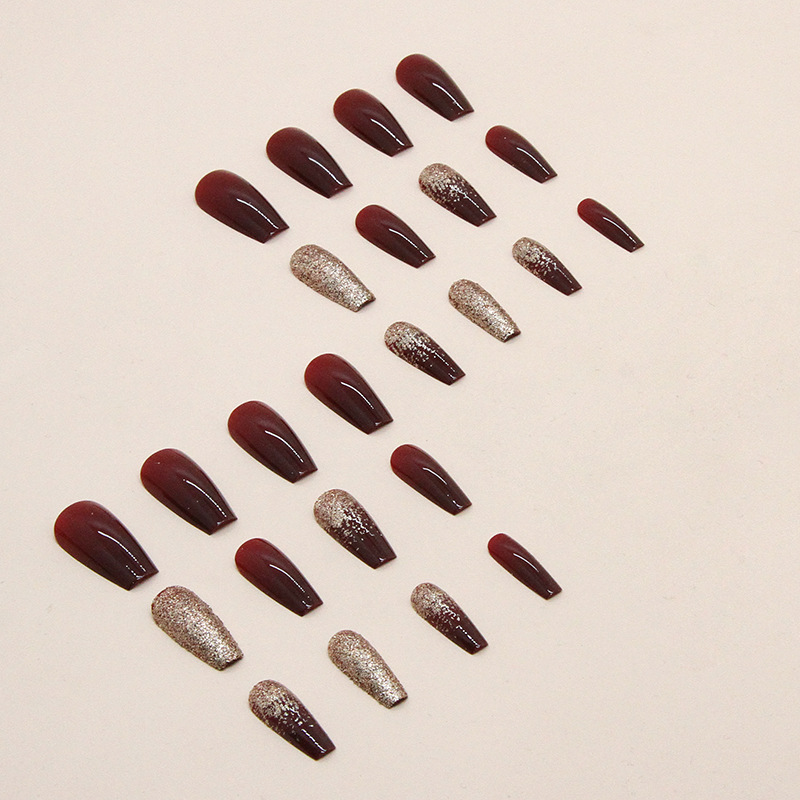 Burgundy glitter nails with gold sparkle press on design